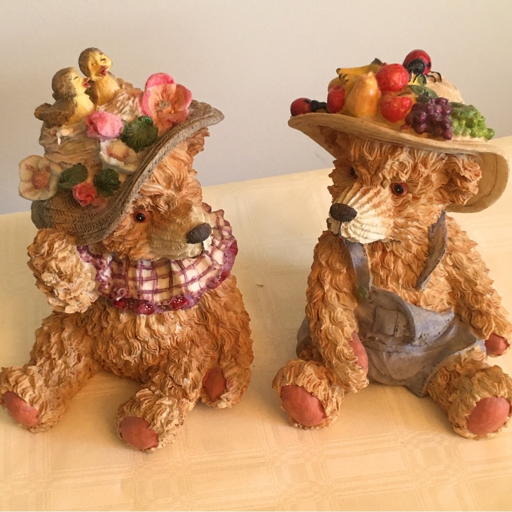 Two cute little bears with hats seven and 8 inches tall. Resin figurines.
